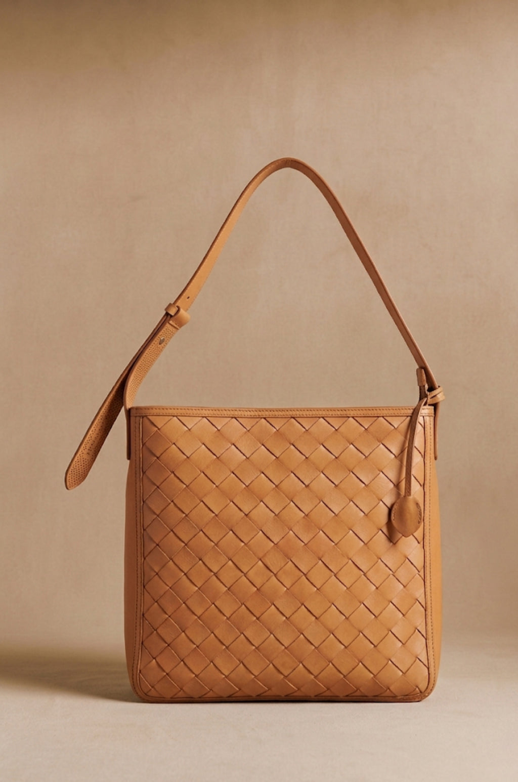 Agnès Oversize braided leather crossbody tote in natural tan, front view — Biche Maison Dréan
