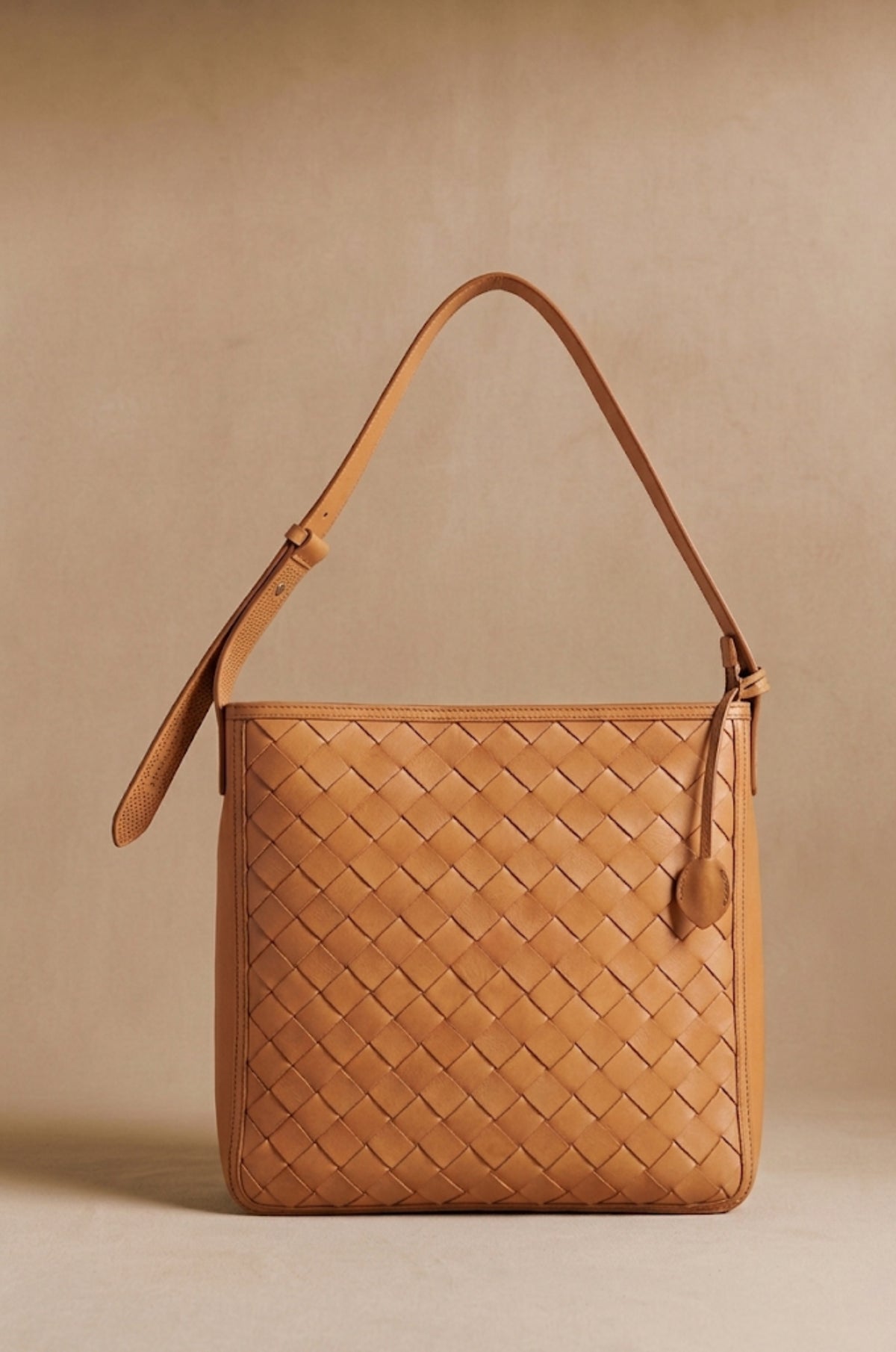 Agnès Oversize braided leather crossbody tote in natural tan, front view — Biche Maison Dréan
