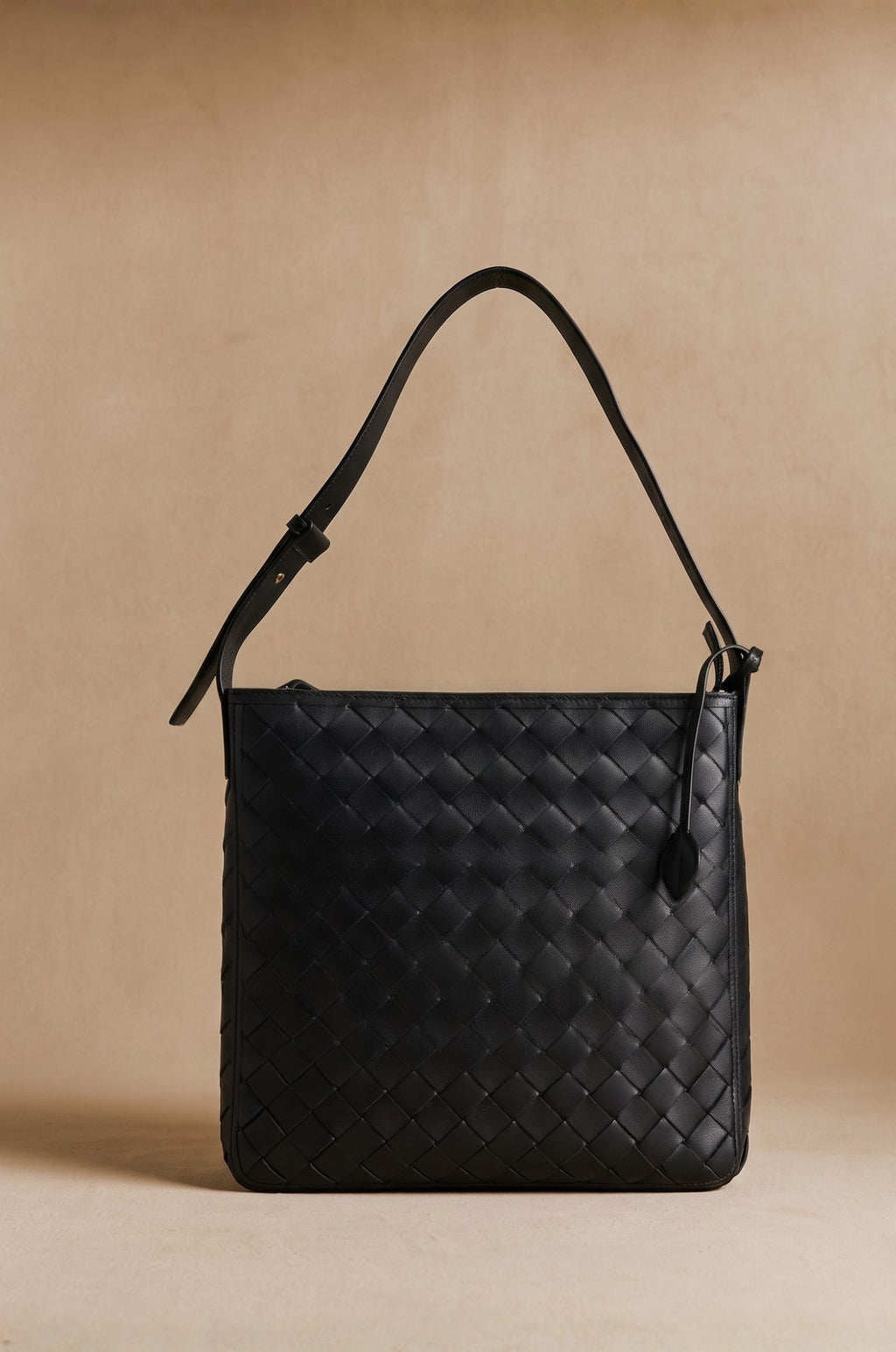 Agnès Oversize braided leather crossbody tote in black, front view — Biche Maison Dréan
