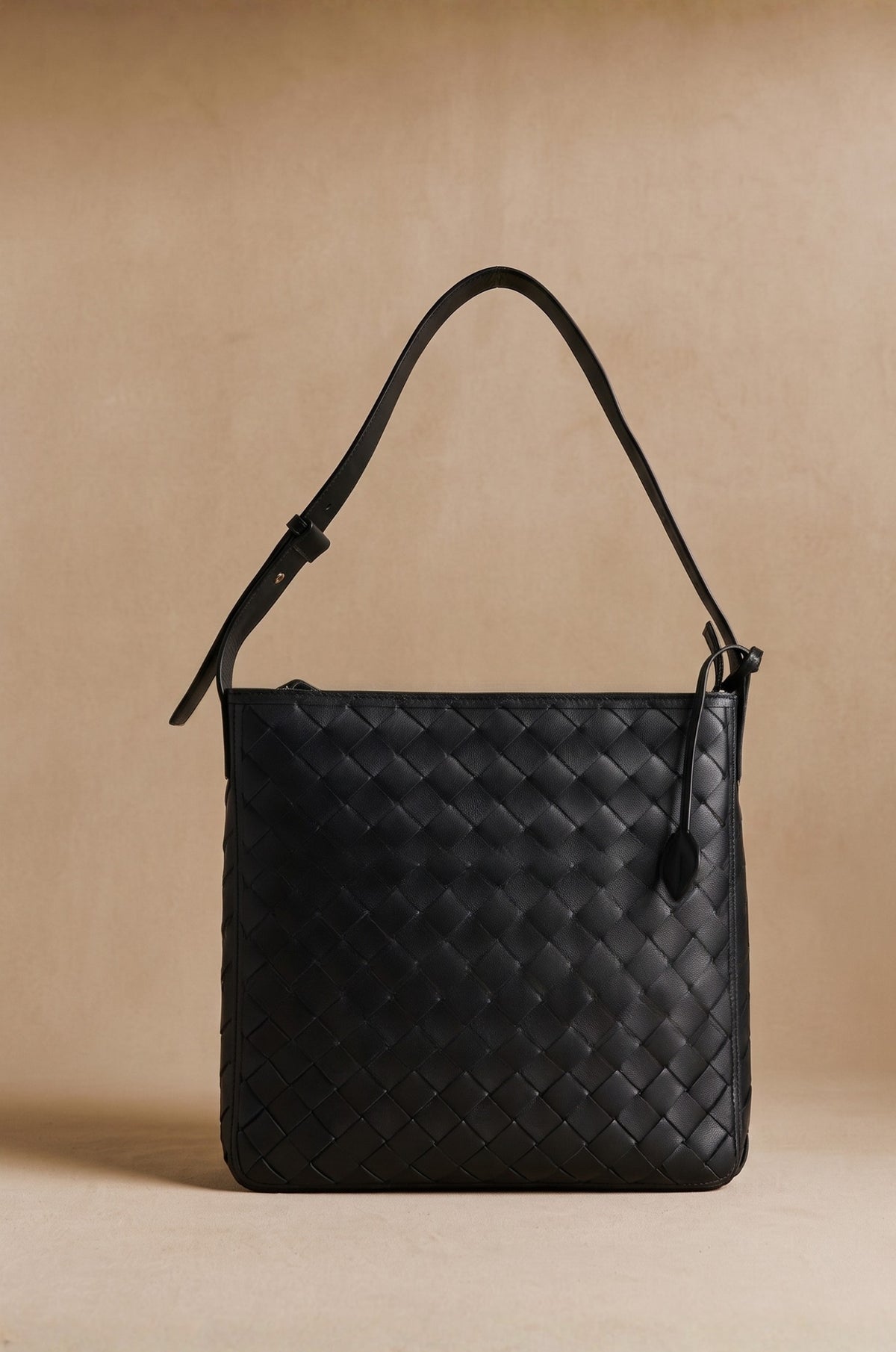 Agnès Oversize braided leather crossbody tote in black, front view — Biche Maison Dréan
