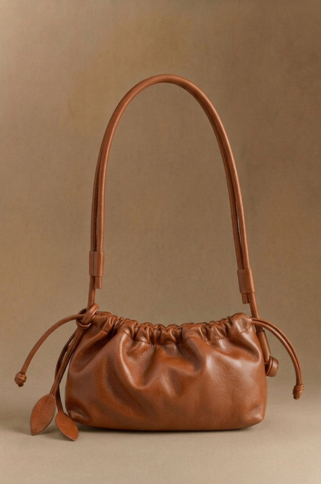 Eva Grande leather laptop bag in cognac, front view — Biche Maison Dréan
