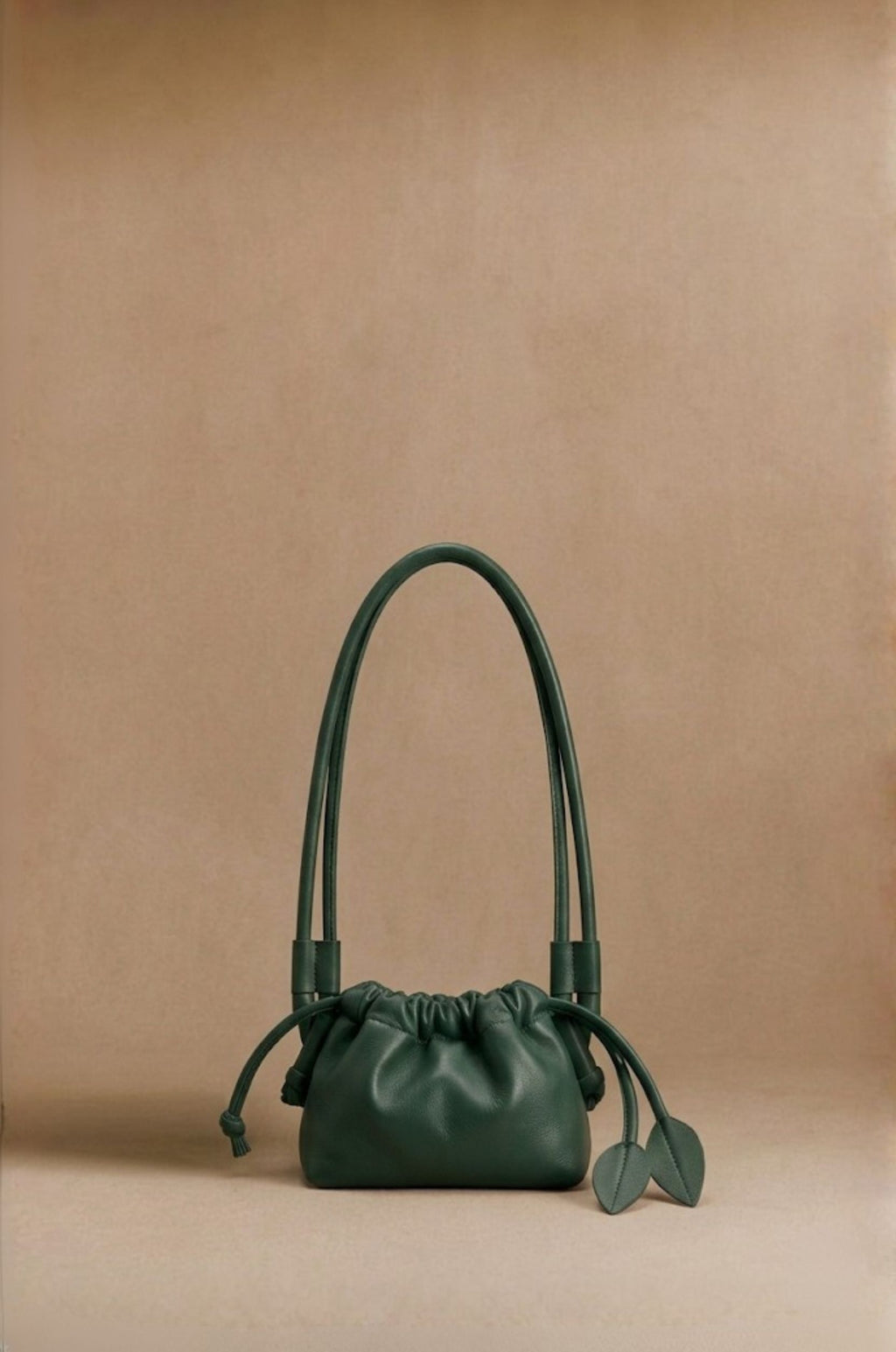 Eva Mini drawstring calf leather bag in olive green, front view — Biche Maison Dréan
