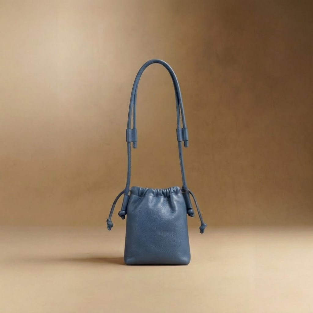 Eva Mini drawstring calf leather bag in nova blue, front view — Biche Maison Dréan

