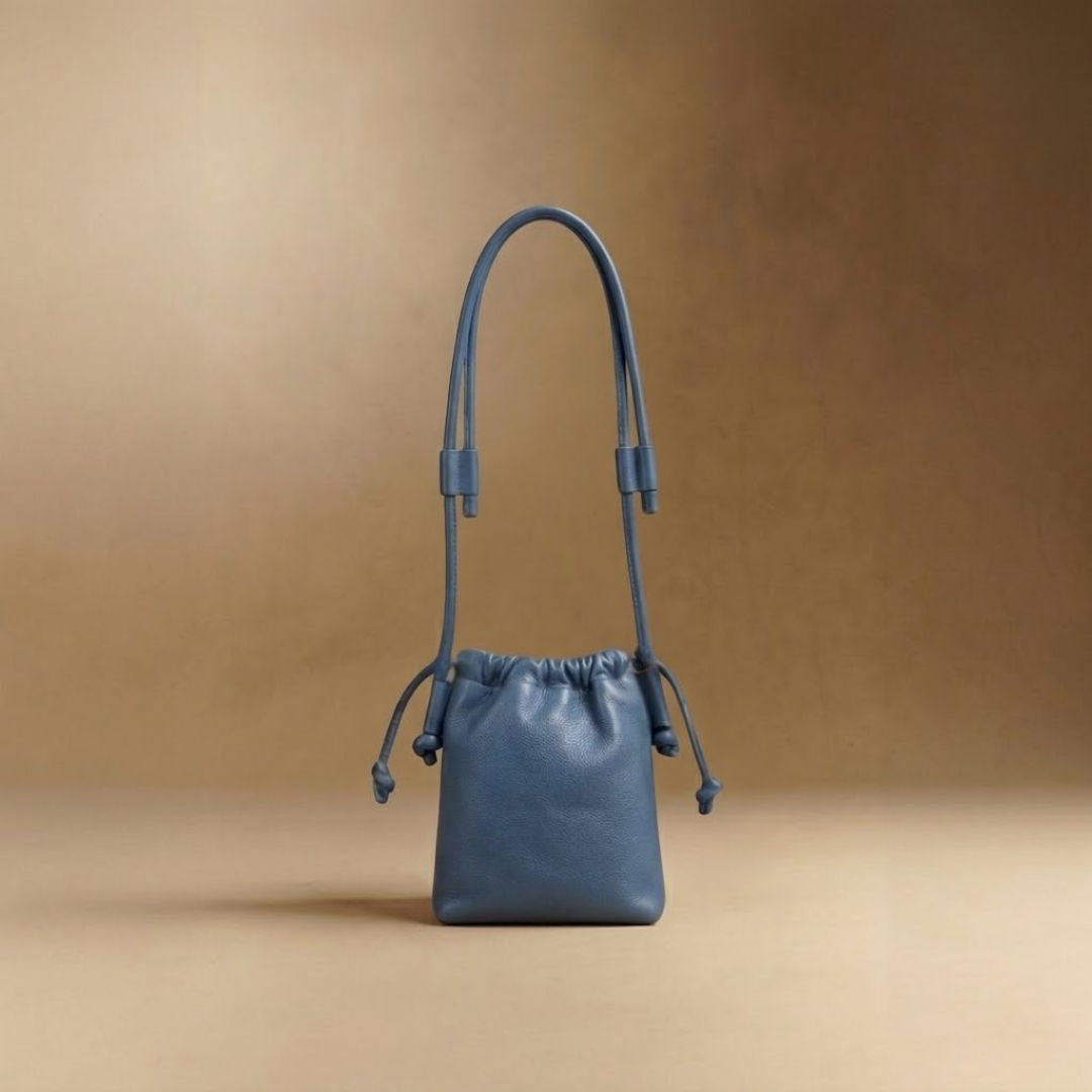 Eva Mini drawstring calf leather bag in nova blue, front view — Biche Maison Dréan
